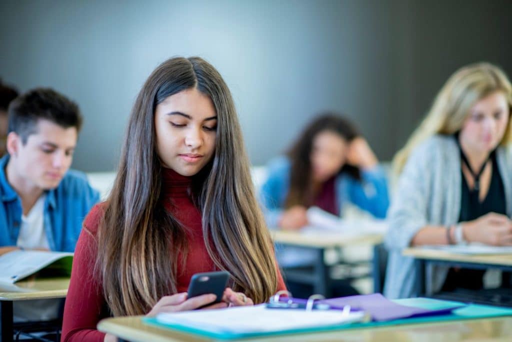 Canadian student uses mobile phone in classroom